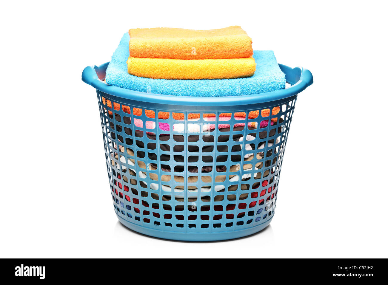A studio shot of colorful towels in a laundry bin Stock Photo Alamy