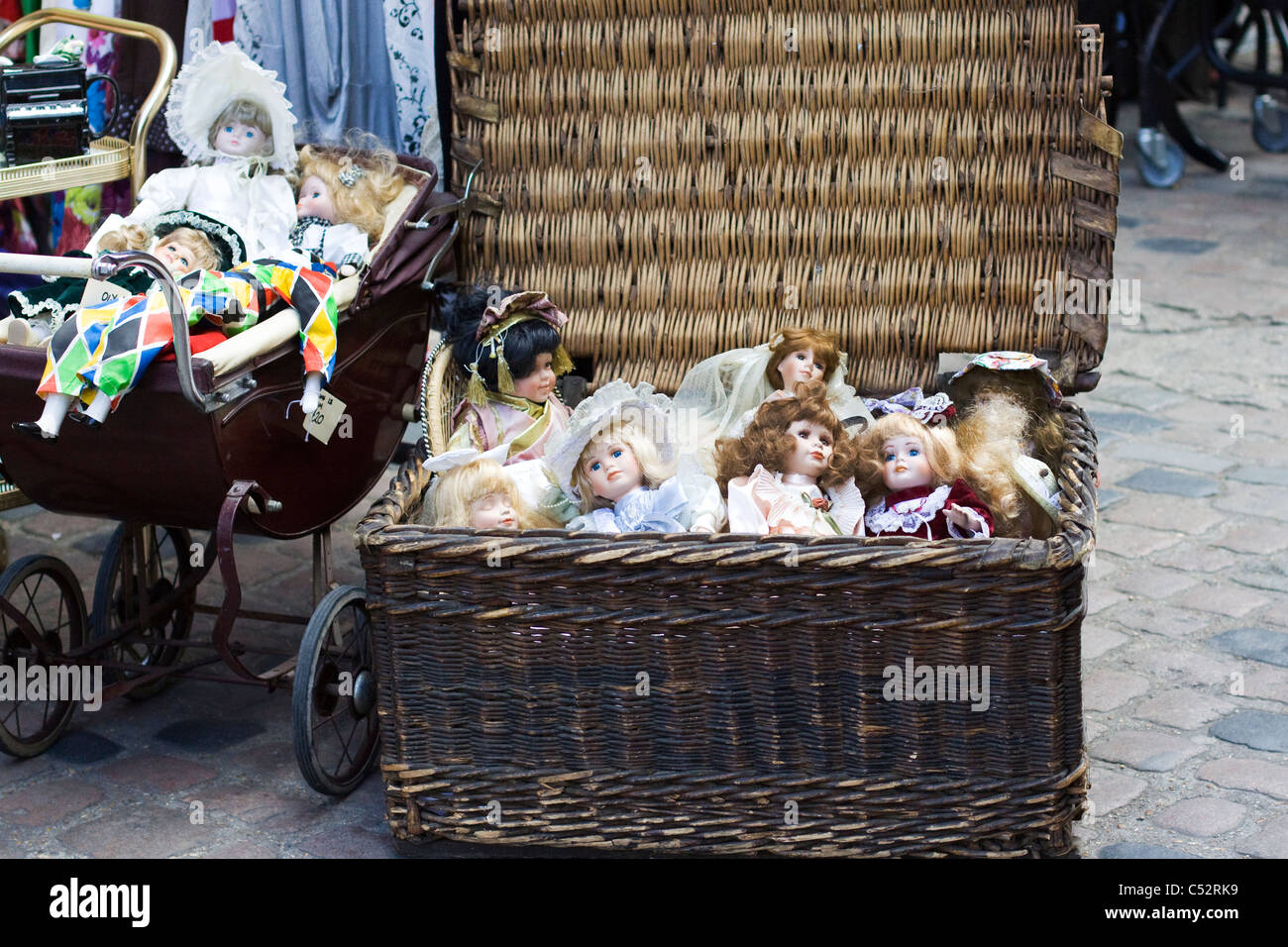 vintage dolls in a wicker basket Stock Photo
