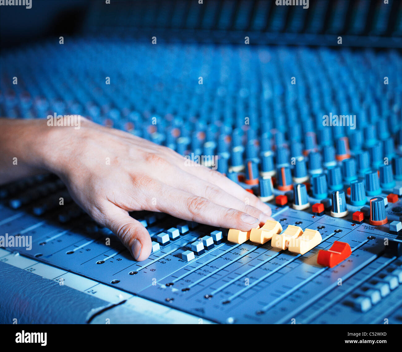 hand on music recording mixing desk Stock Photo Alamy
