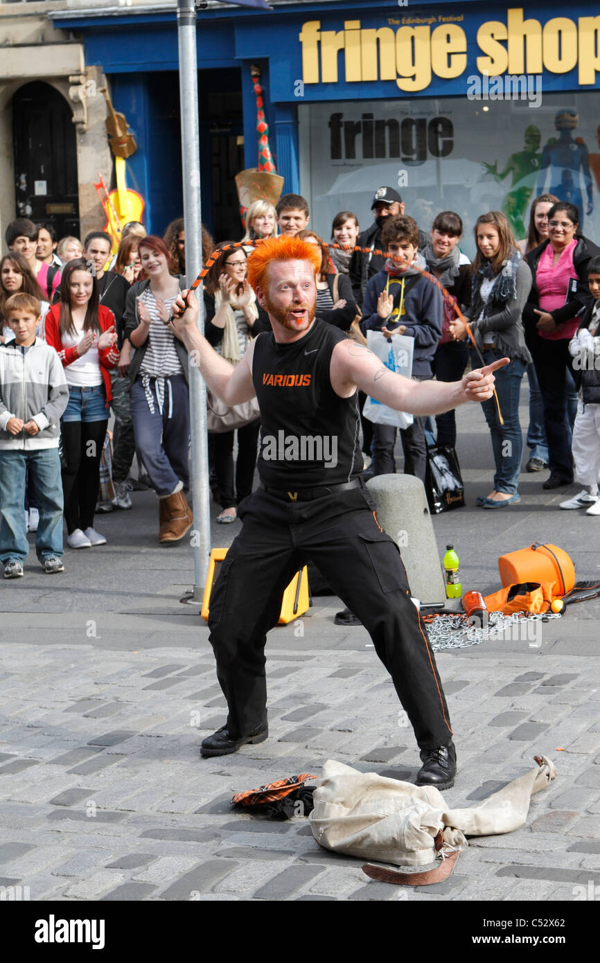 Escape artist Todd Various on the Royal Mile in Edinburgh with a crowd watching Stock Photo