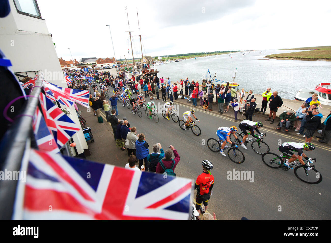 The Tour of Britain cycle race rolls through the town of Wells in Norfolk Stock Photo