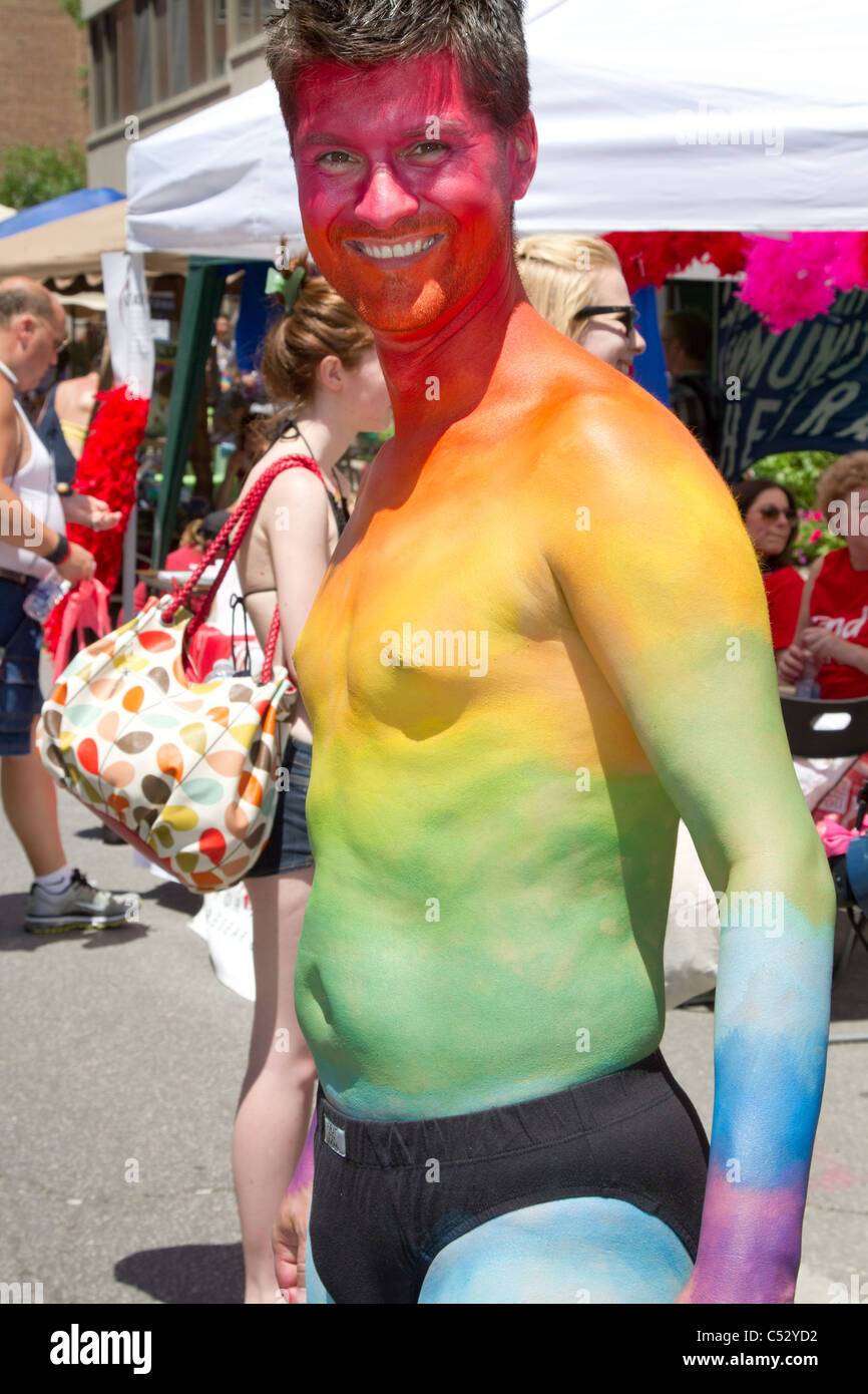 colorful body paint man pride street celebration Stock Photo