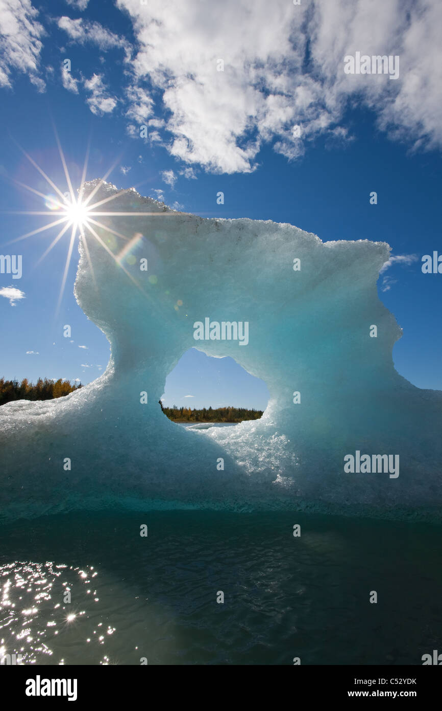 Sunny view of an iceberg in Mendenhall Lake with the sun shining from behind, Southeast Alaska, Summer Stock Photo