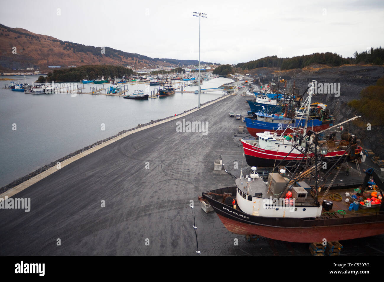 View of commercial fishing vessels hauled out in the Kodiak Boatyard for maintenance and repair, Kodiak, Alaska Stock Photo