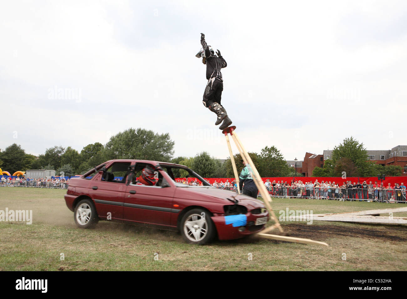 Stool stunt with car Stock Photo