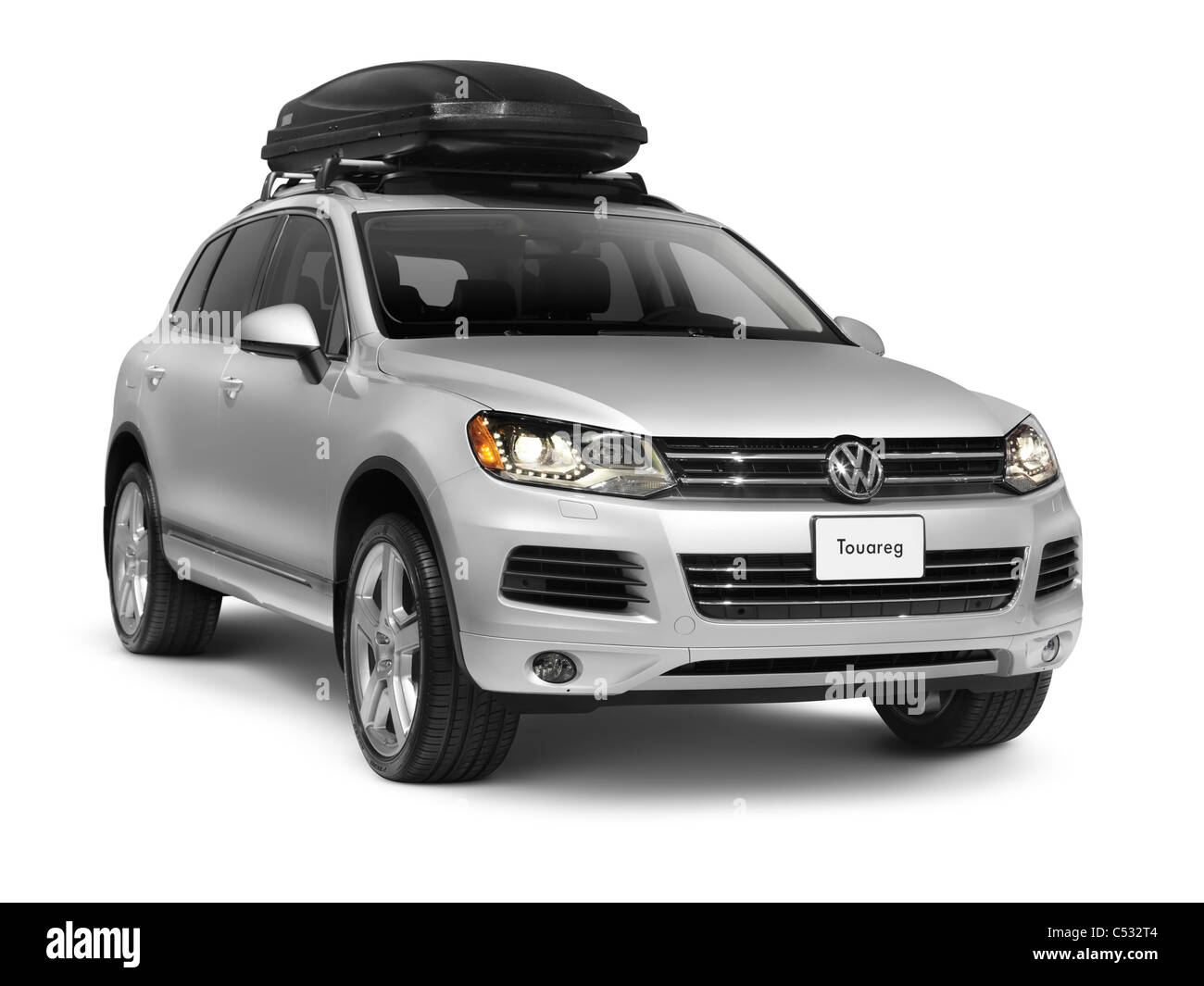 License available at MaximImages.com - Silver Volkswagen Touareg mid-size crossover SUV with a roof box. Isolated car on white background with cl Stock Photo