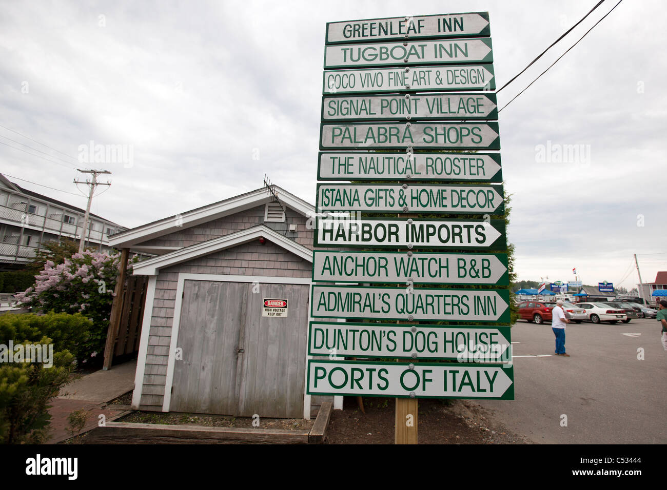 A pole of signs in Boothbay Harbor Maine Stock Photo