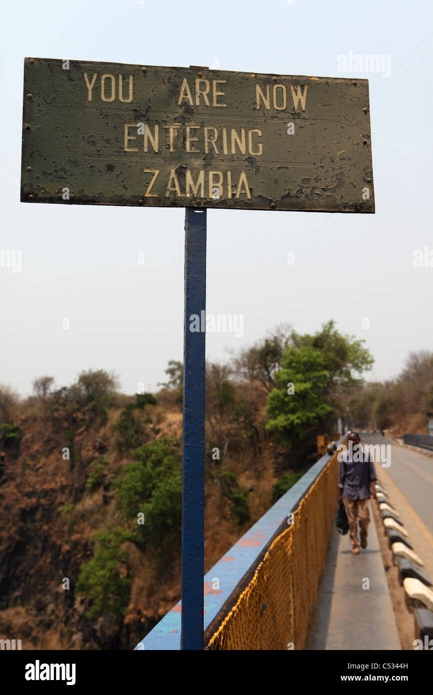 A sign on the Victoria Falls Bridge, which spans the gorge along the border between Zambia and Zimbabwe. Stock Photo