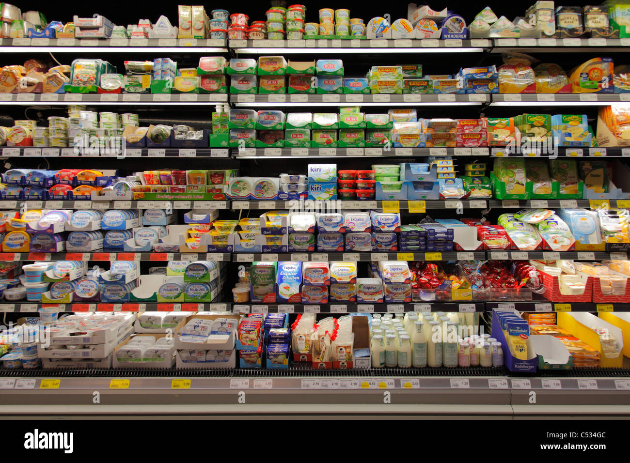 dairy products in a refrigerated shelf in a supermarket Stock Photo