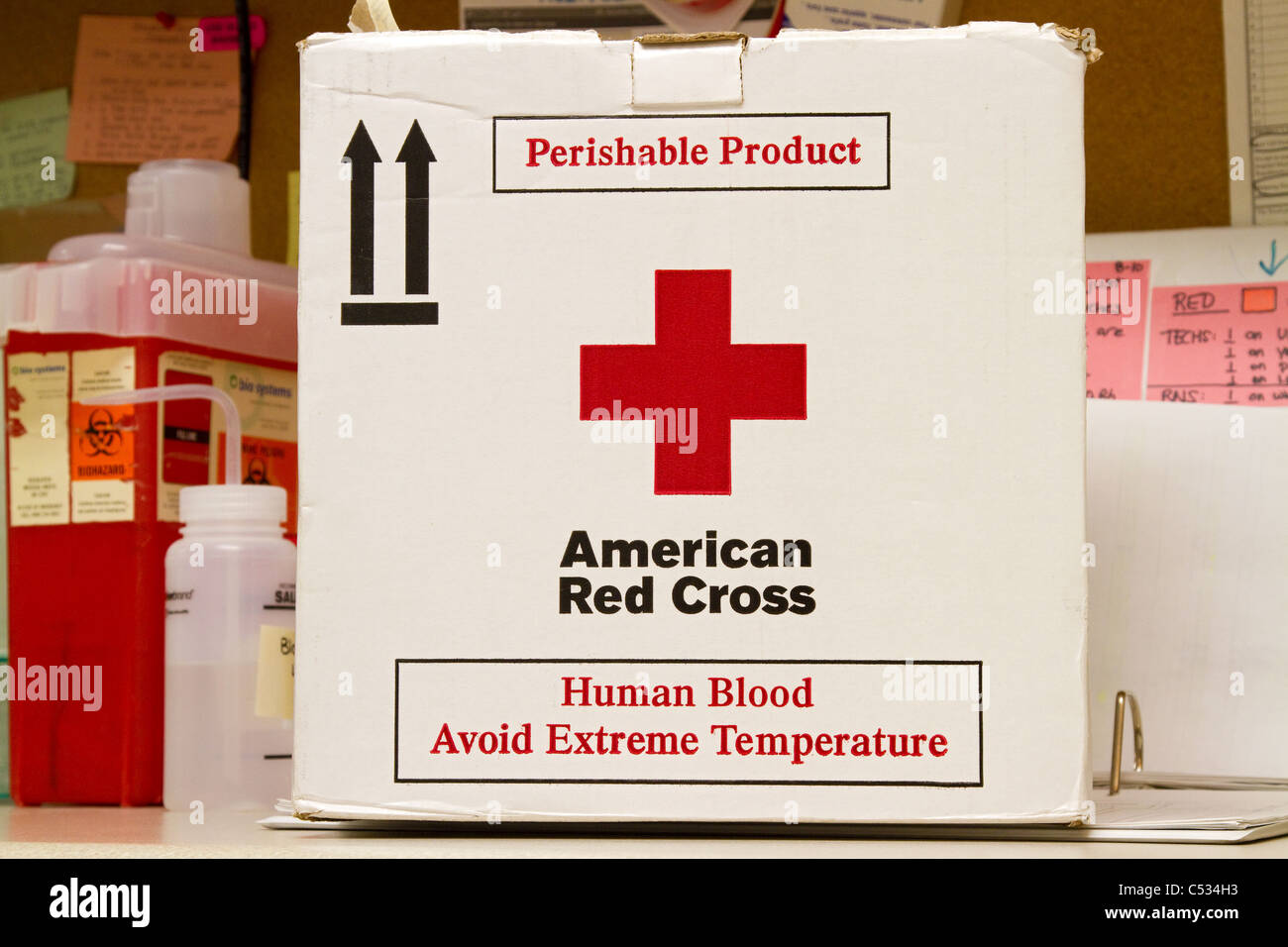 Red Cross container used for blood drive and for storage of blood bag