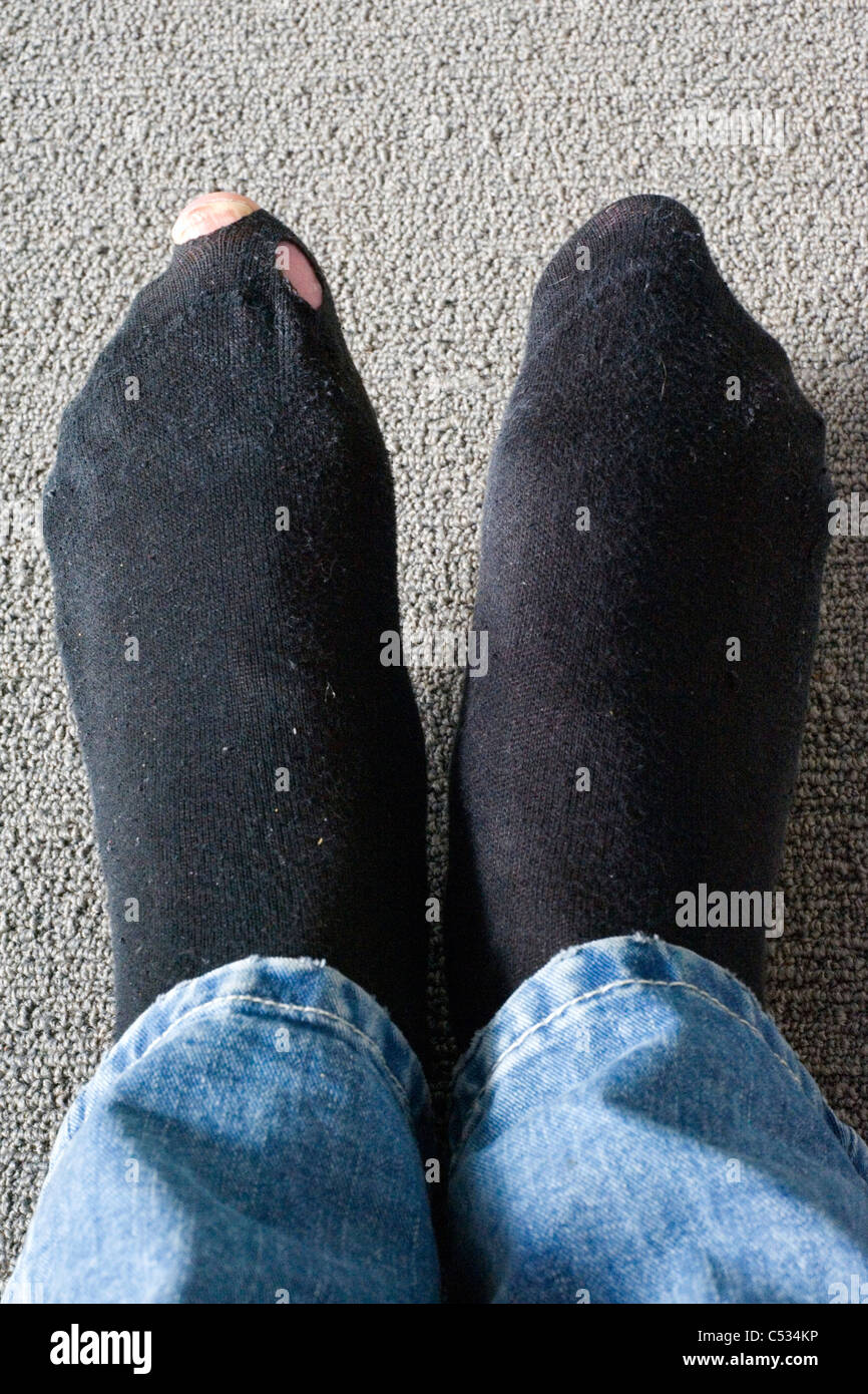 toes poking through running shoes