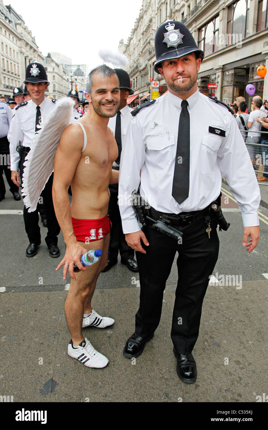 Participant with the Police in the London Gay Pride Parade 2011 Stock Photo