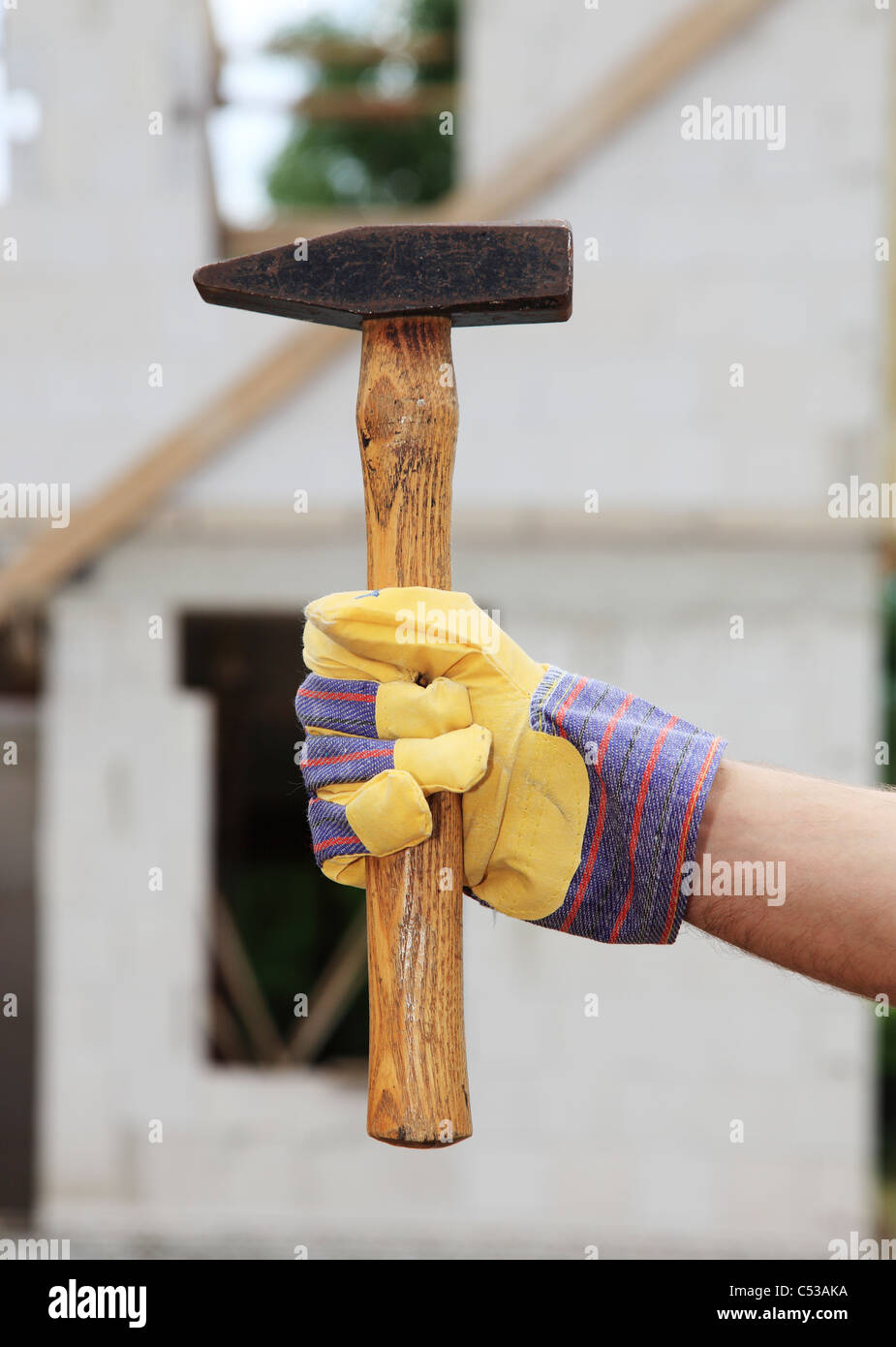 Manual worker carrying a sledge. Stock Photo