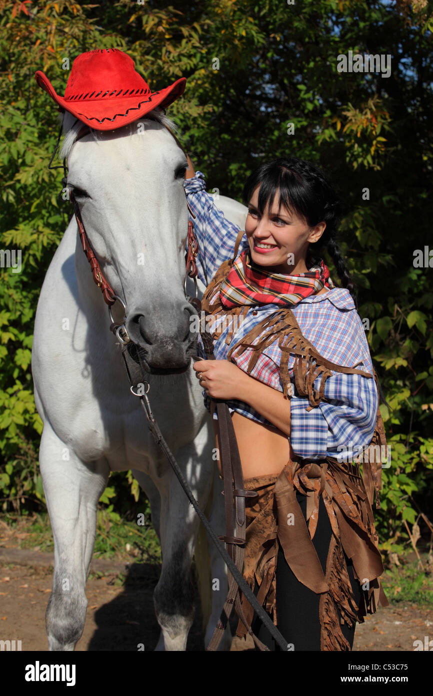 Happy horseback rider (participant role-playing game) in western dress Stock Photo