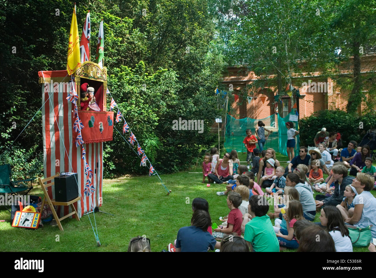 Punch and Judy Show at Petersham village fete Richmond Surrey. UK.  2011 2010s HOMER SYKES Stock Photo