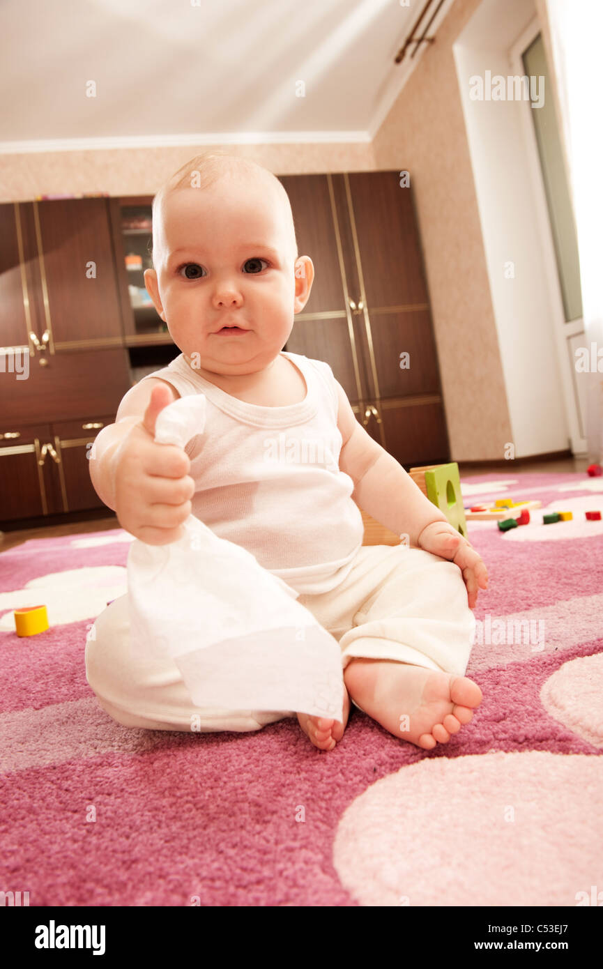Cute baby girl s playing with toys in playroom Stock Photo - Alamy