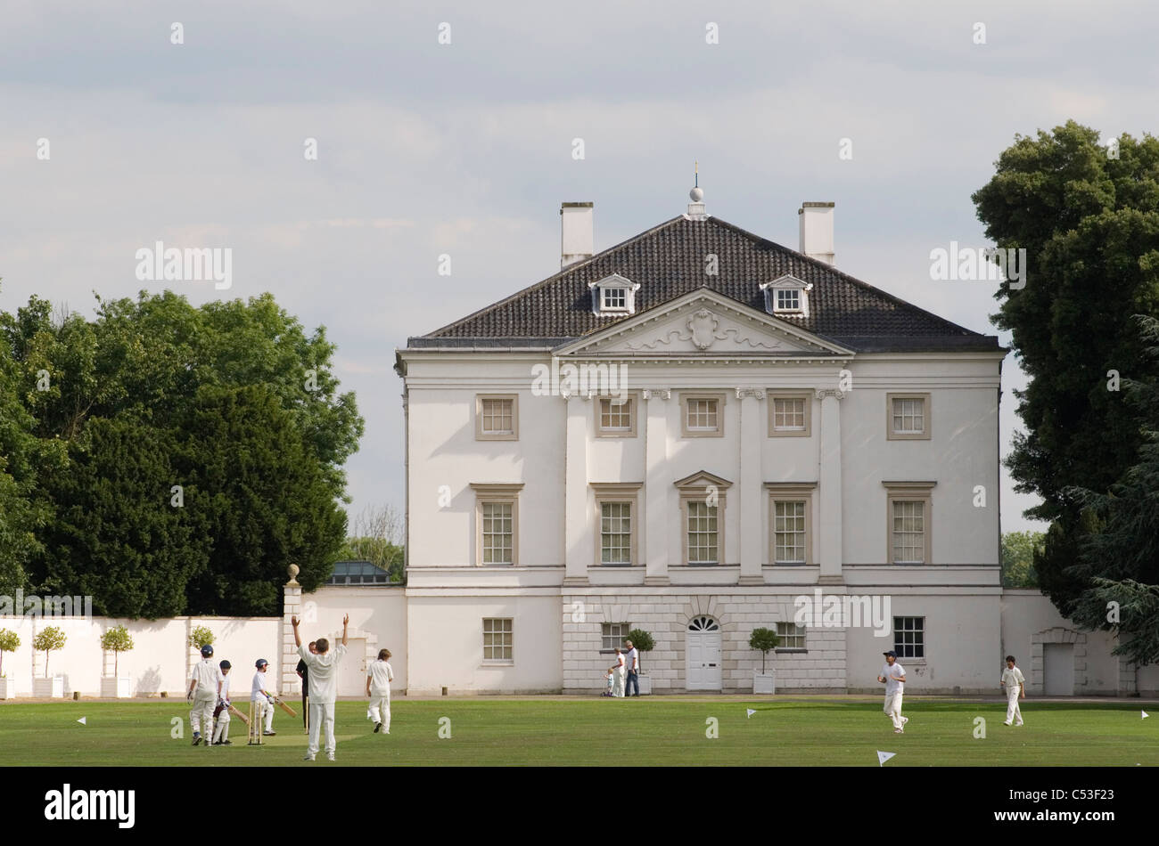 Marble Hill House Twickenham Middlesex. England. London school children playing cricket in grounds in front of Marble Hill House HOMER SYKES Stock Photo