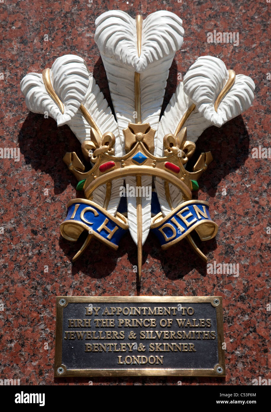 Prince of Wales's feathers and motto Ich Dien (I Serve) on Bentley & Skinner jewellers, London Stock Photo