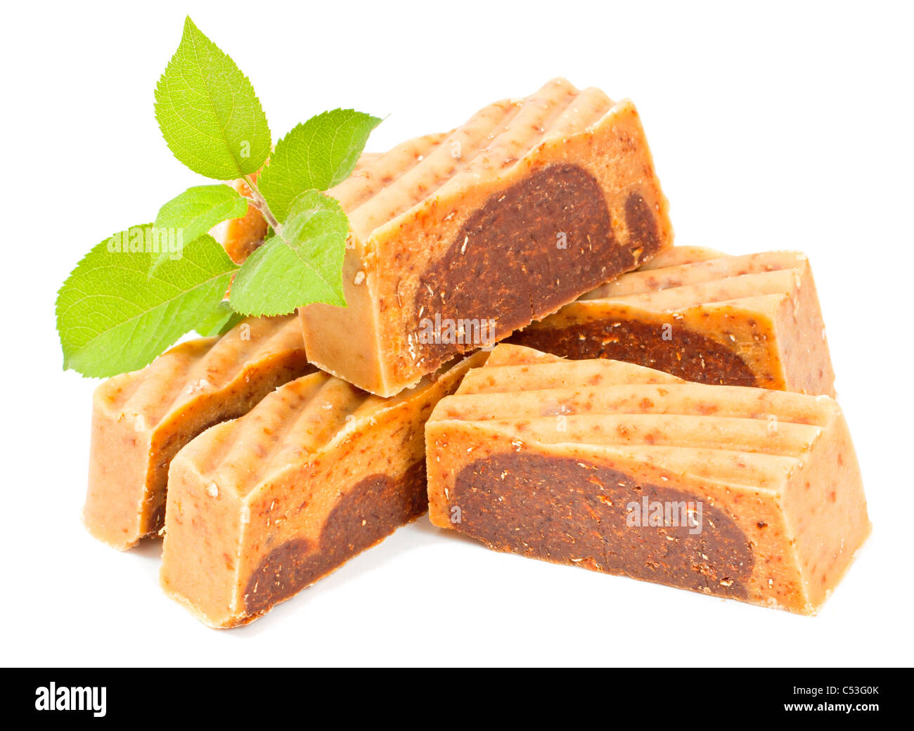 Handmade soap with green twig on white background. Stock Photo