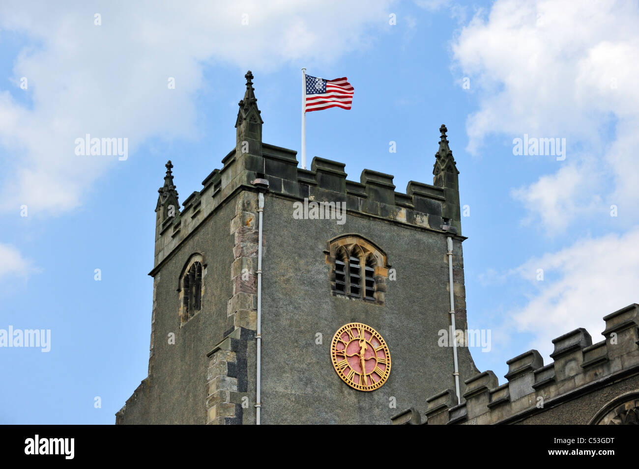 The 'Stars and Stripes' flying at the Church of Saint Oswald. Warton, Lancashire, England, United Kingdom, Europe. Stock Photo
