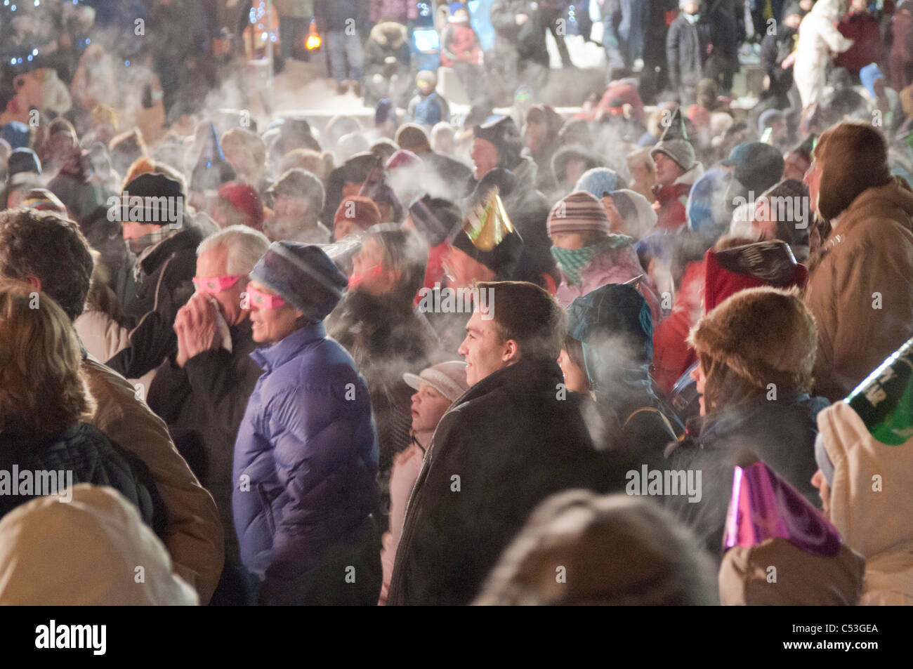 Crowd gathers to bring in the New Year at Town Square Park, downtown Anchorage, Southcentral Alaska, Winter Stock Photo