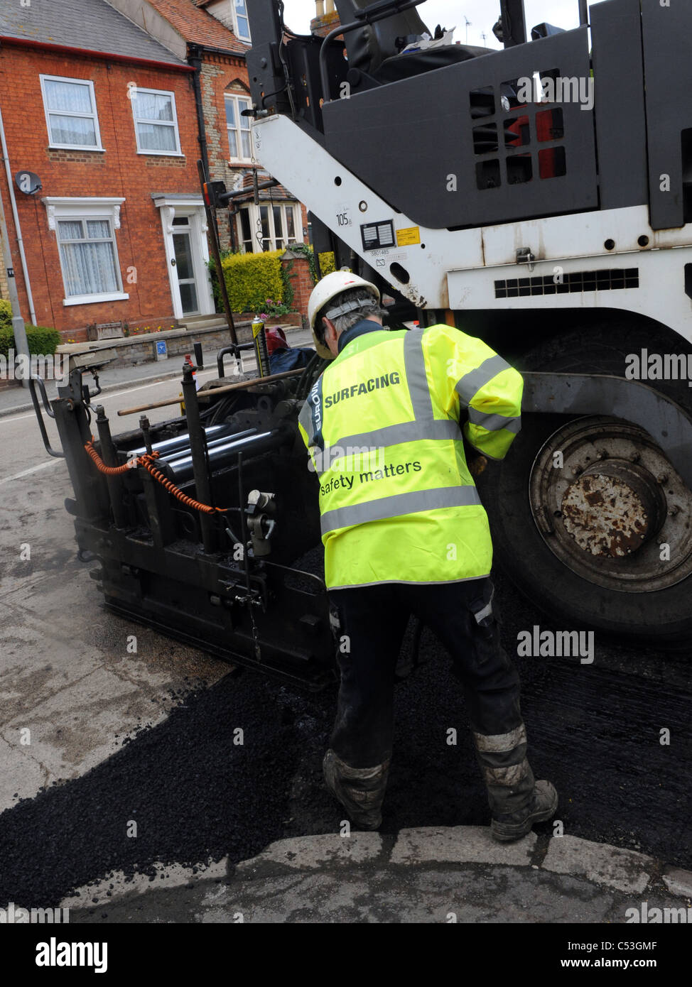 Road resurfacing by council workmen. Stock Photo