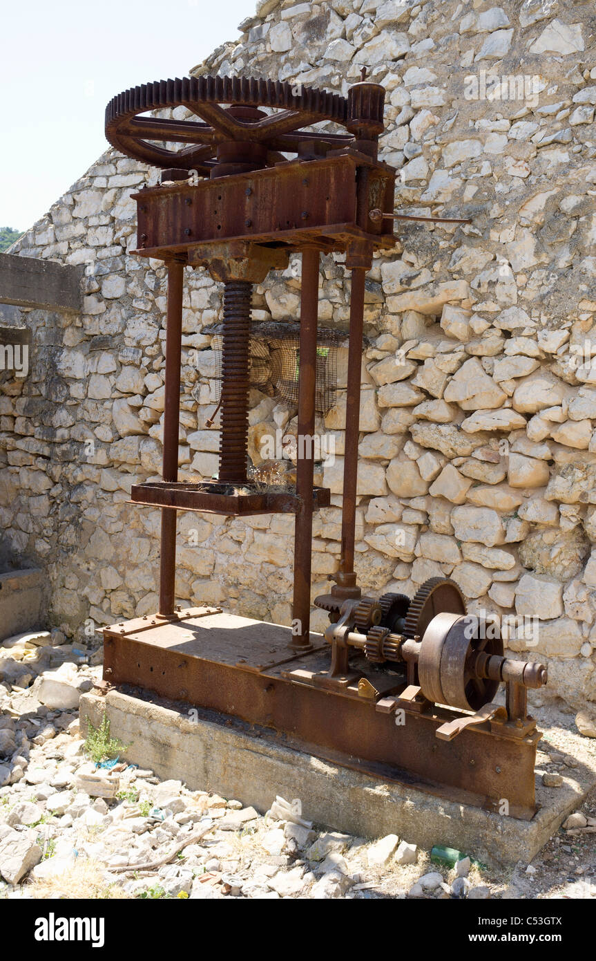 Abandoned olive press, Port Leone, Kalamos, Greece Stock Photo