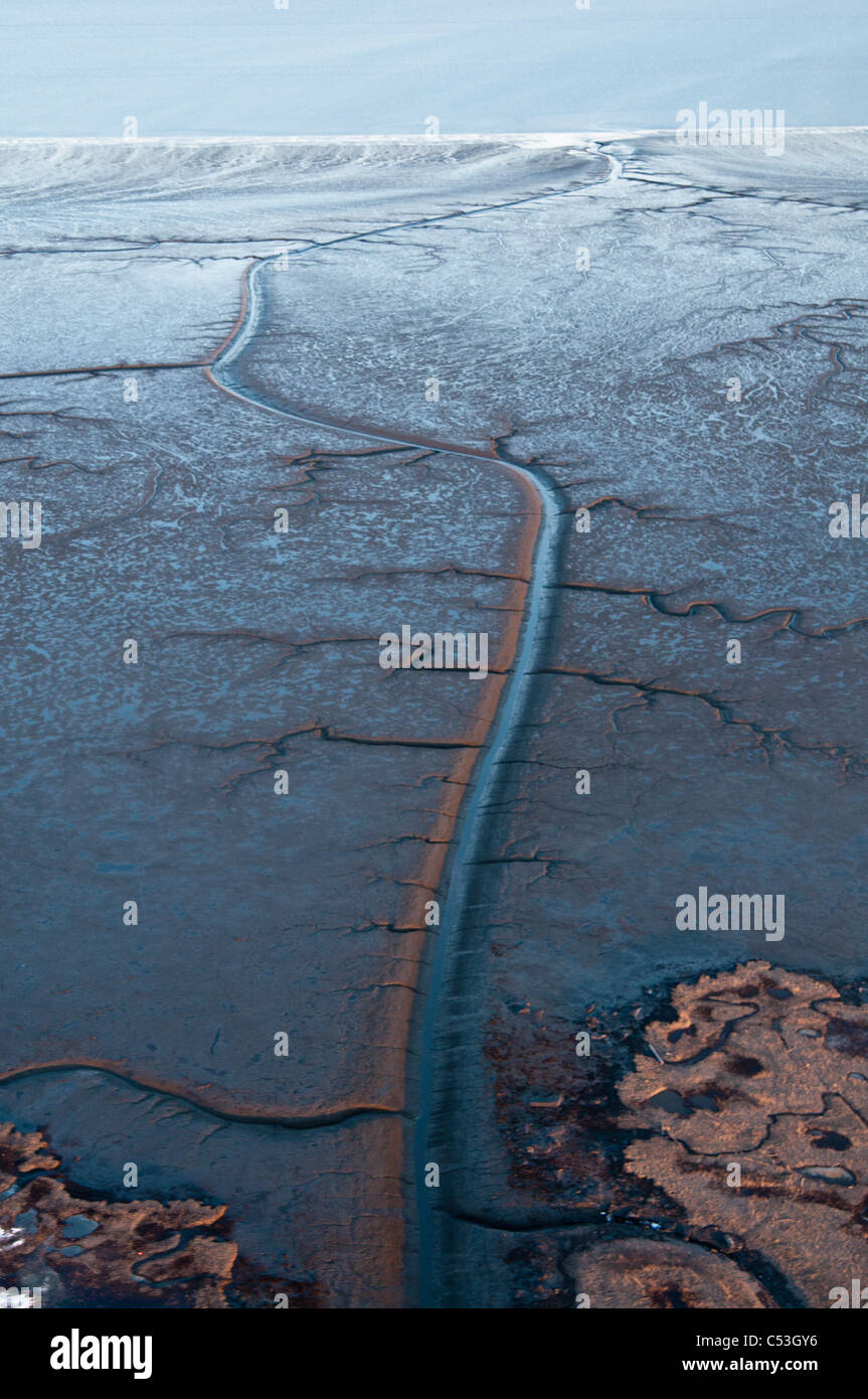 Aeral evening view of patterns in the mud flats of Cook Inlet near the Drift River, Southcentral Alaska, Winter Stock Photo