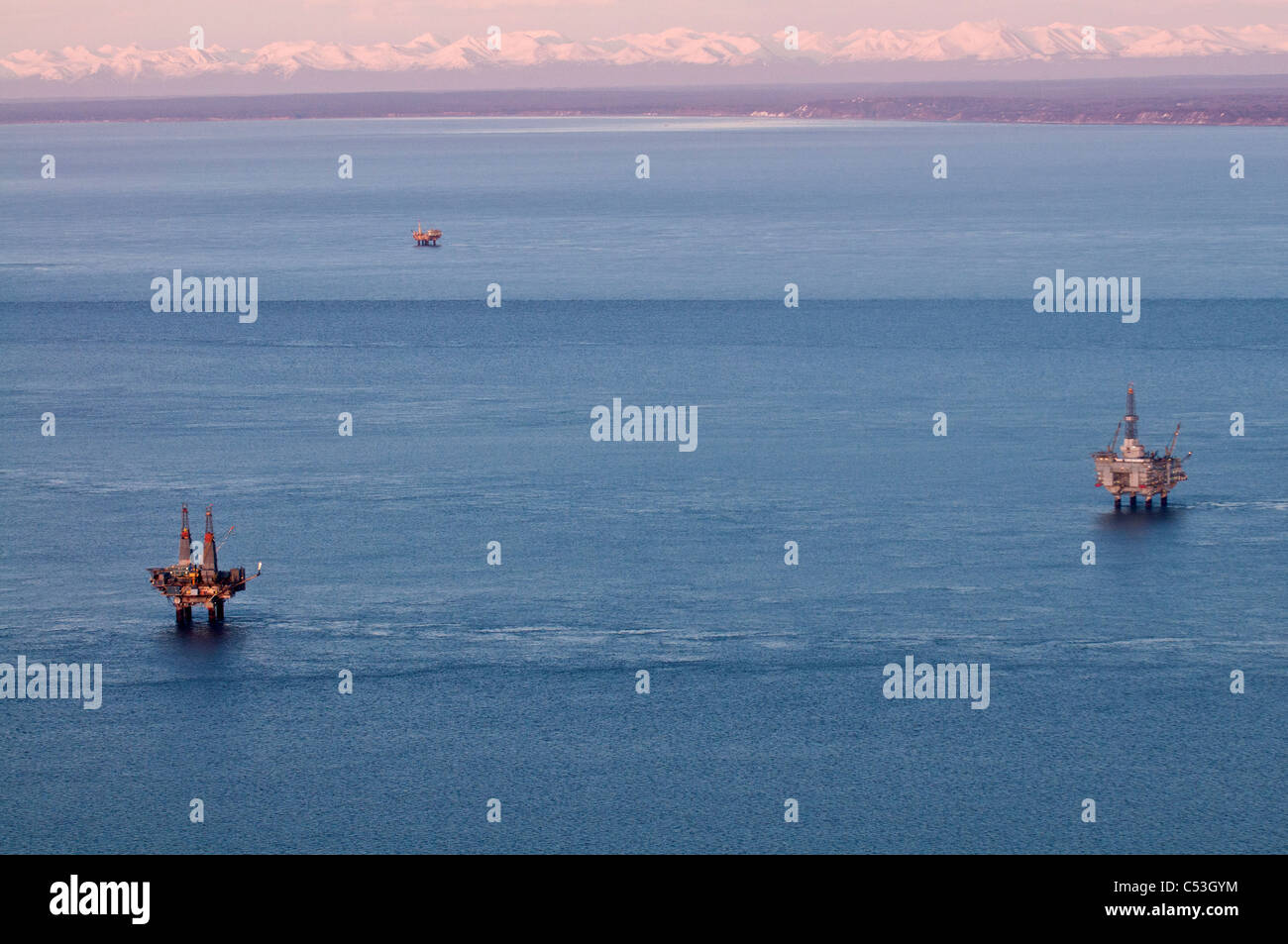 Aerial evening view of oil platform in Cook Inlet, Southcentral Alaska, Winter Stock Photo