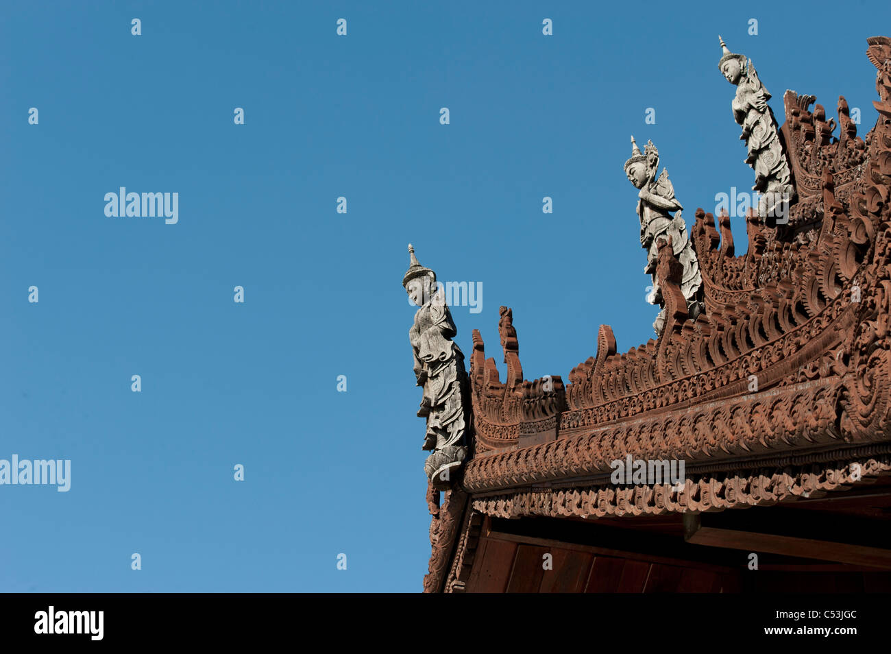 Apsara statues on the top of Mandarin Oriental Dhara Dhevi, Chiang Mai, Thailand Stock Photo