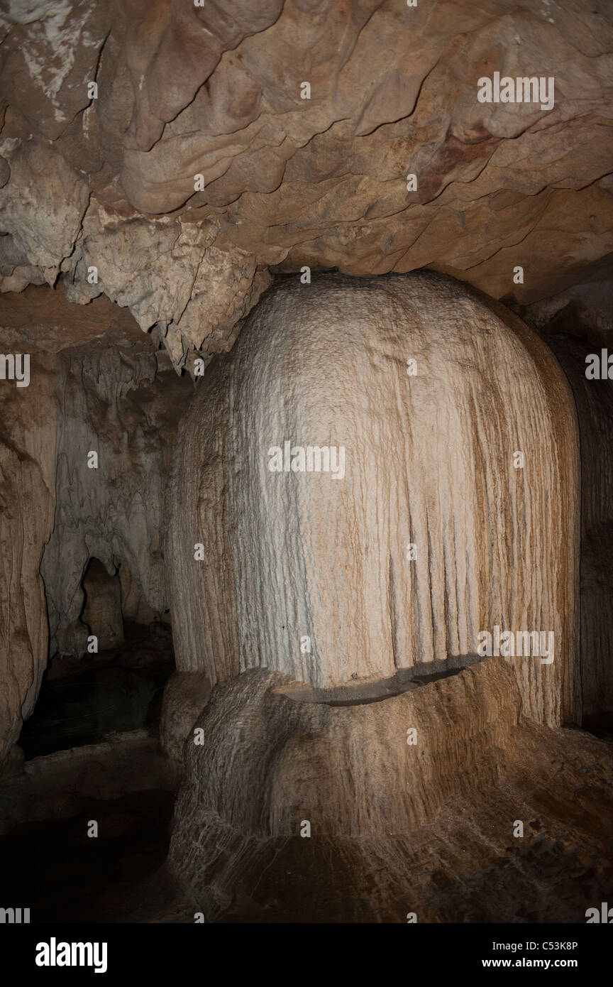 Mineral deposits on rocks in a cave, Thailand Stock Photo