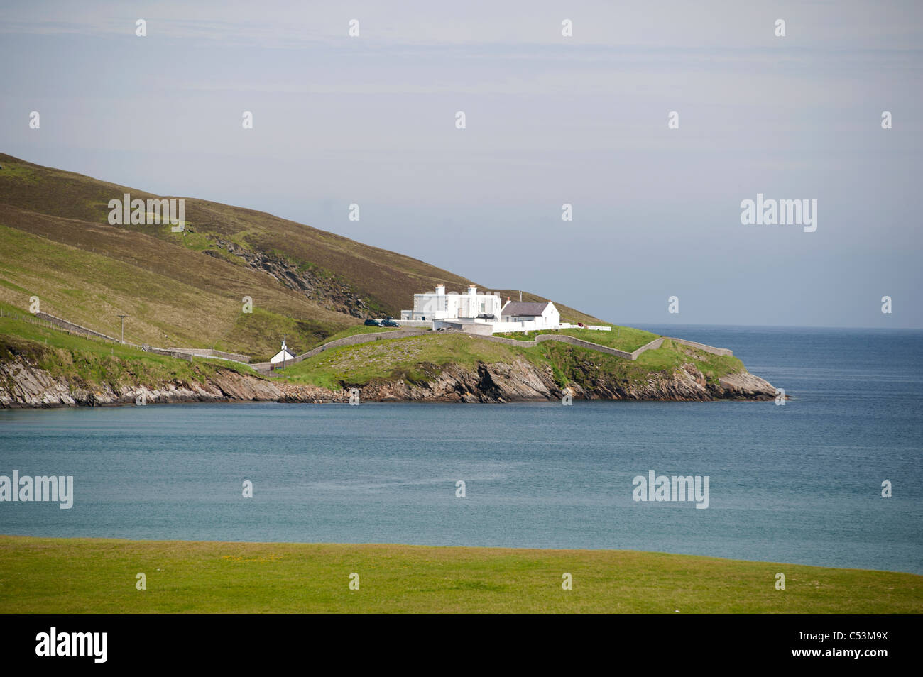 Burra Firth and Hermaness lighthouse at Fiska Wick Isle of Unst Shetland Islands. SCO 7474 Stock Photo