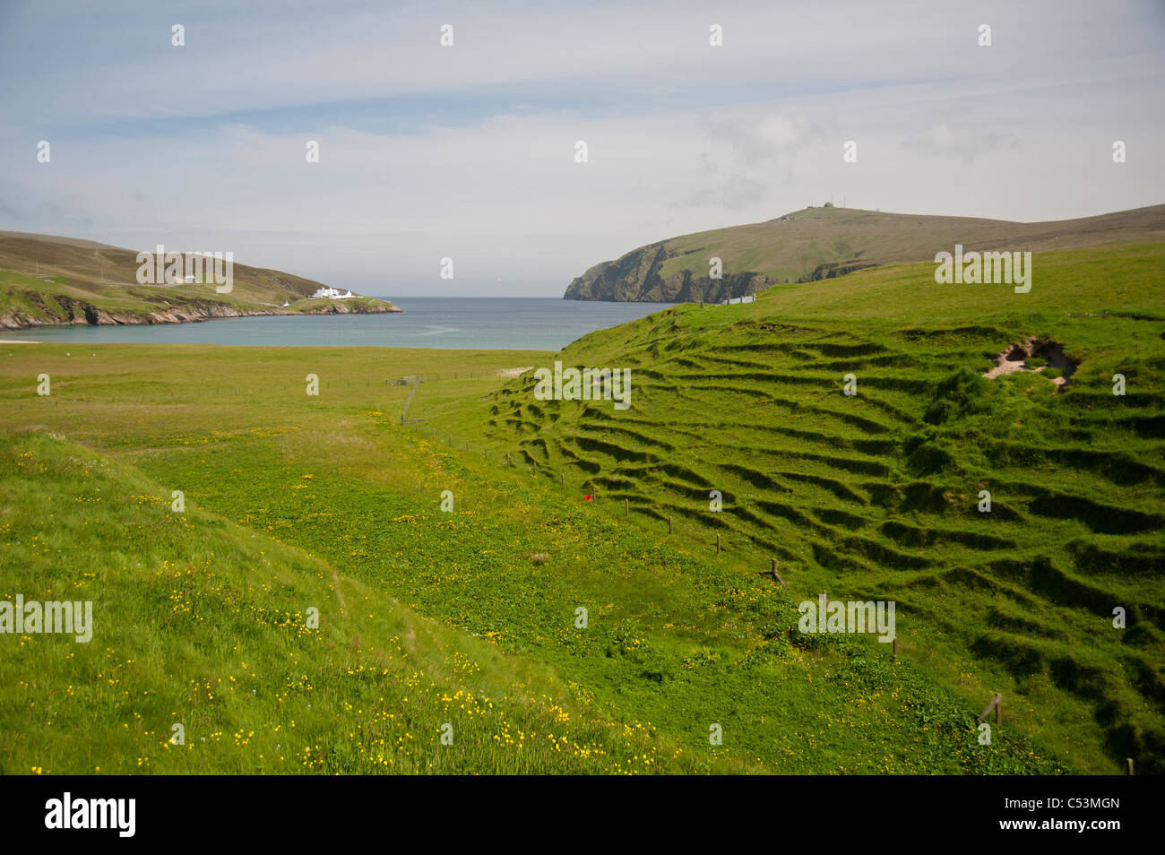 Burra Firth and Hermaness lighthouse at Fiska Wick Isle of Unst Shetland Islands. SCO 7477 Stock Photo
