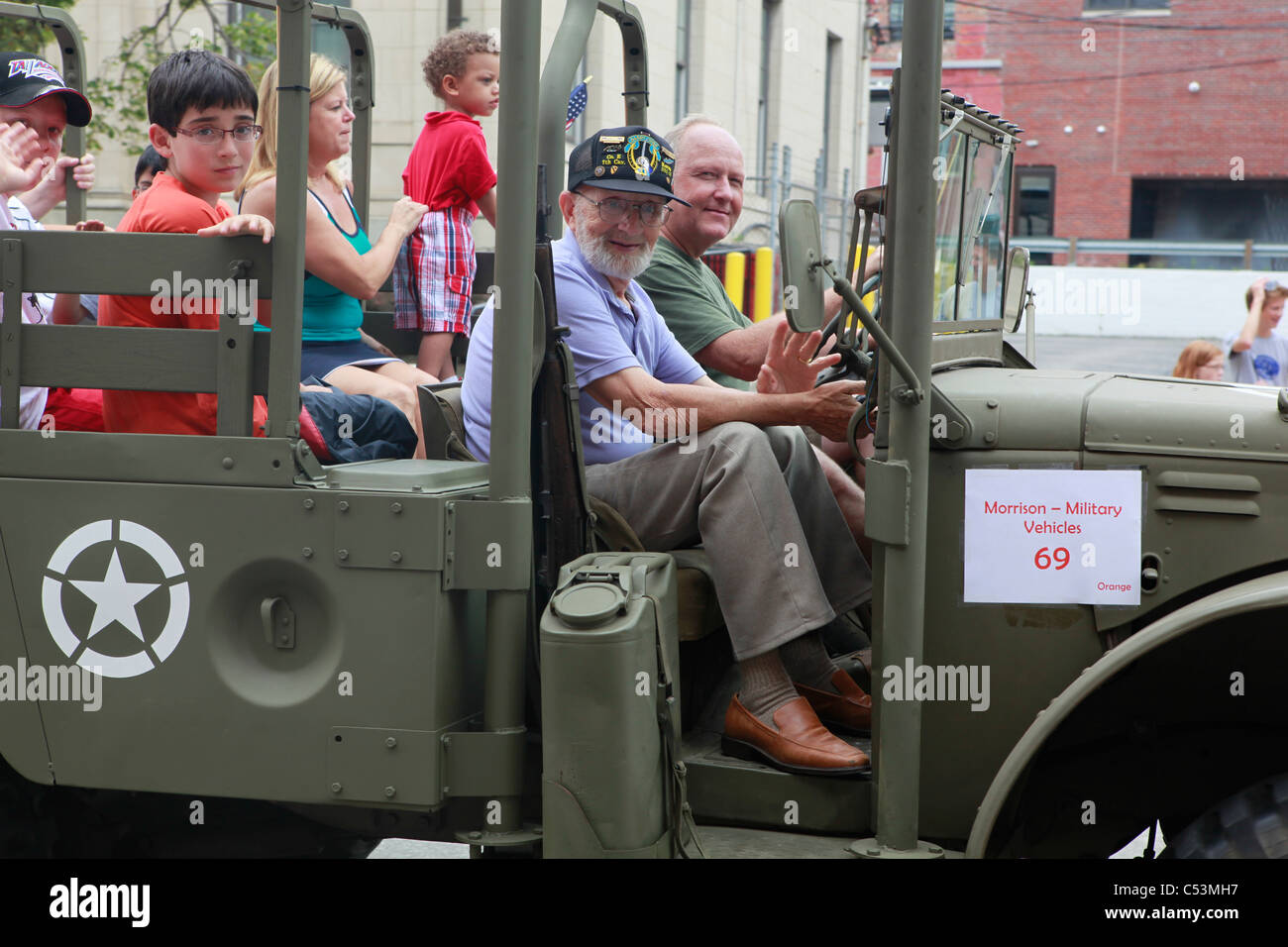 Veteran of the 7th Cavalry Division riding in military vehicle during 4th of July Parade --- Bloomington  Stock Photo
