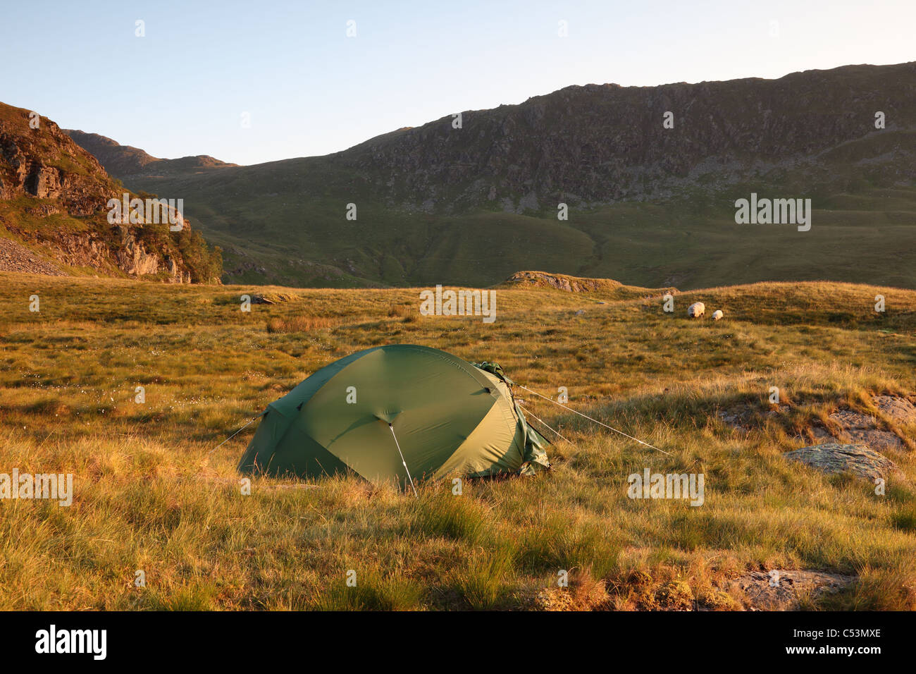 Wild Camping Near Small Water with Rough Crag Leading to High Street Mountain in the Background Lake District Cumbria Stock Photo