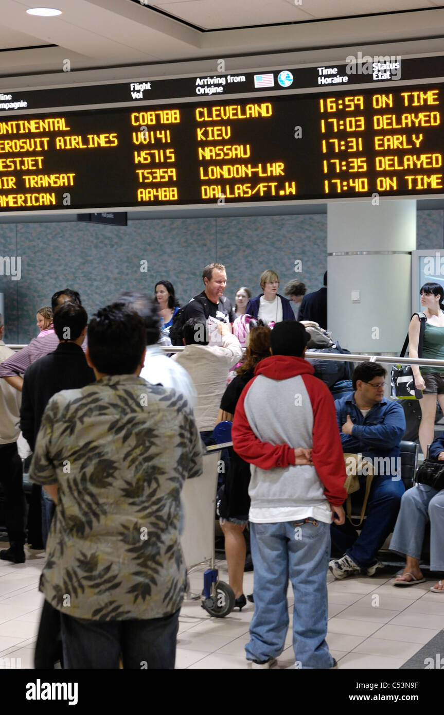 People waiting at arrivals hall of Toronto Pearson International airport. Ontario, Canada 2009. Stock Photo