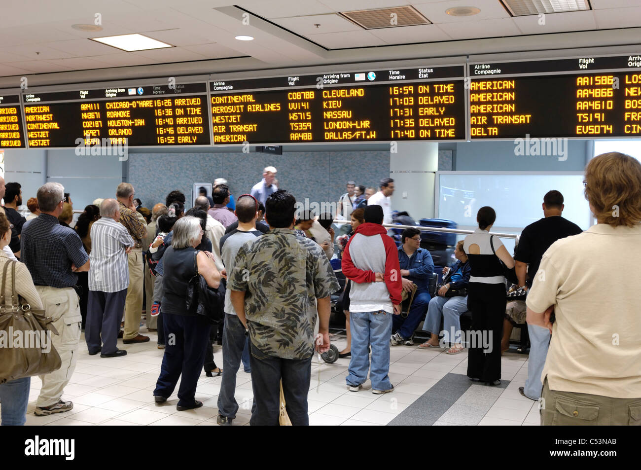 People waiting at arrivals hall of Toronto Pearson International airport. Ontario, Canada 2009. Stock Photo