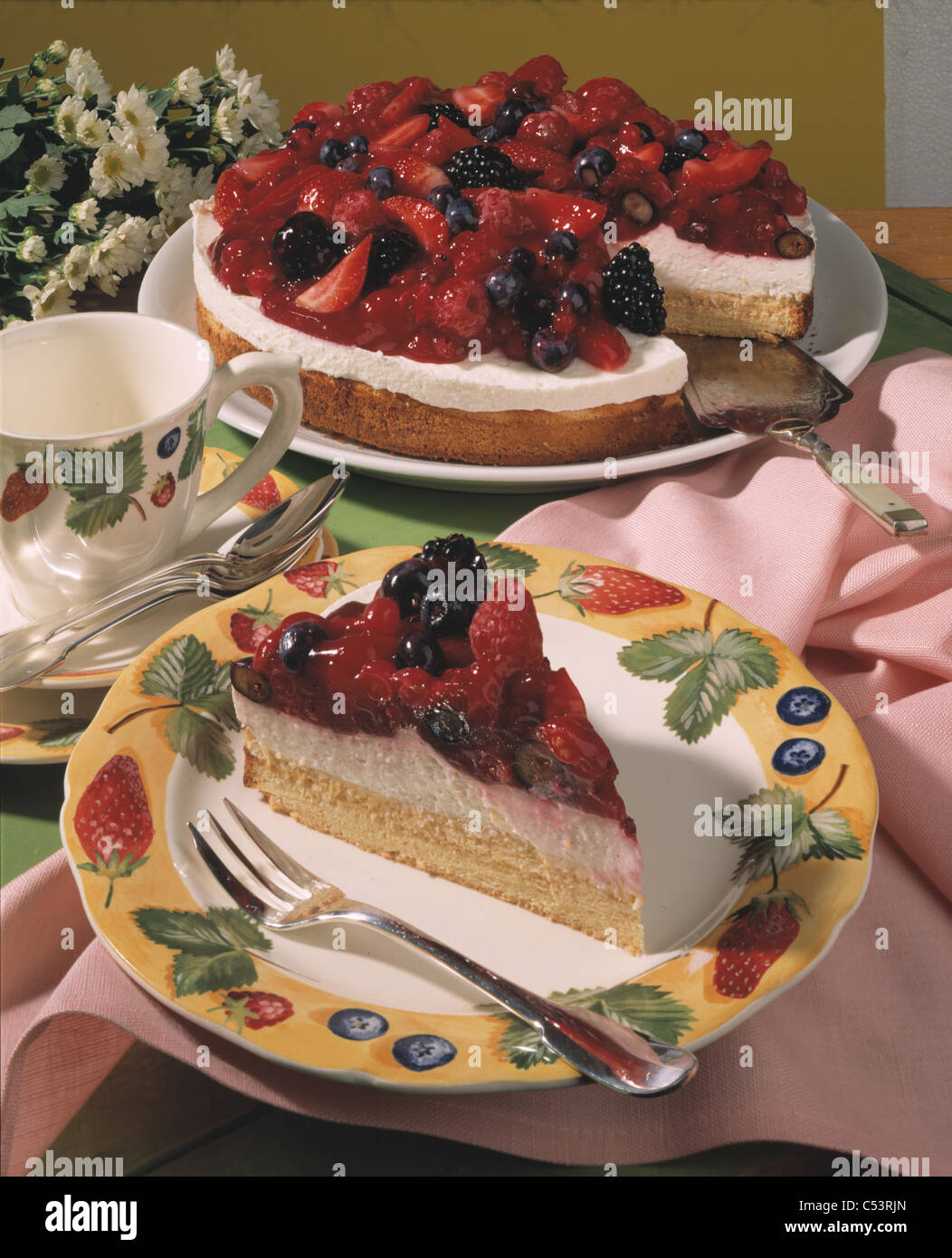 Red fruit jelly yogurt tart on pyramid cake base Stock Photo Alamy