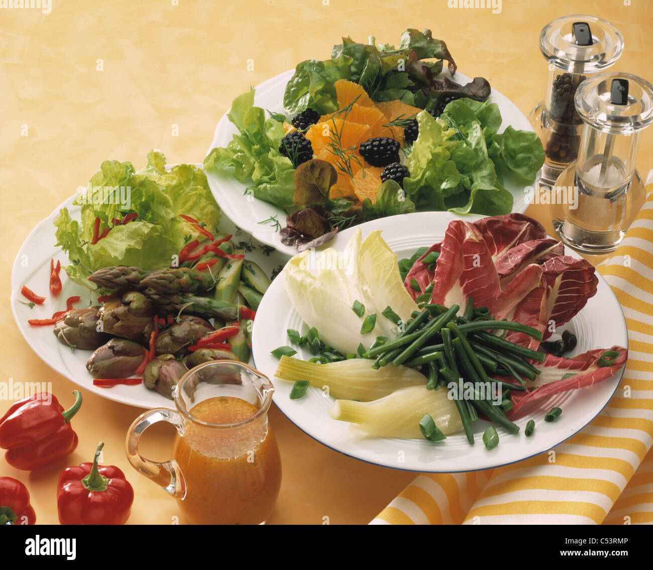 Tableau: Salads with blackberries and oranges / with asparagus and artichoke hearts / with green beans Stock Photo
