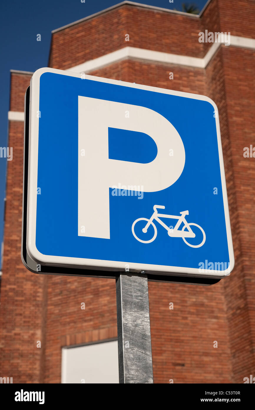 Blue bicycle sign in urban setting Stock Photo Alamy