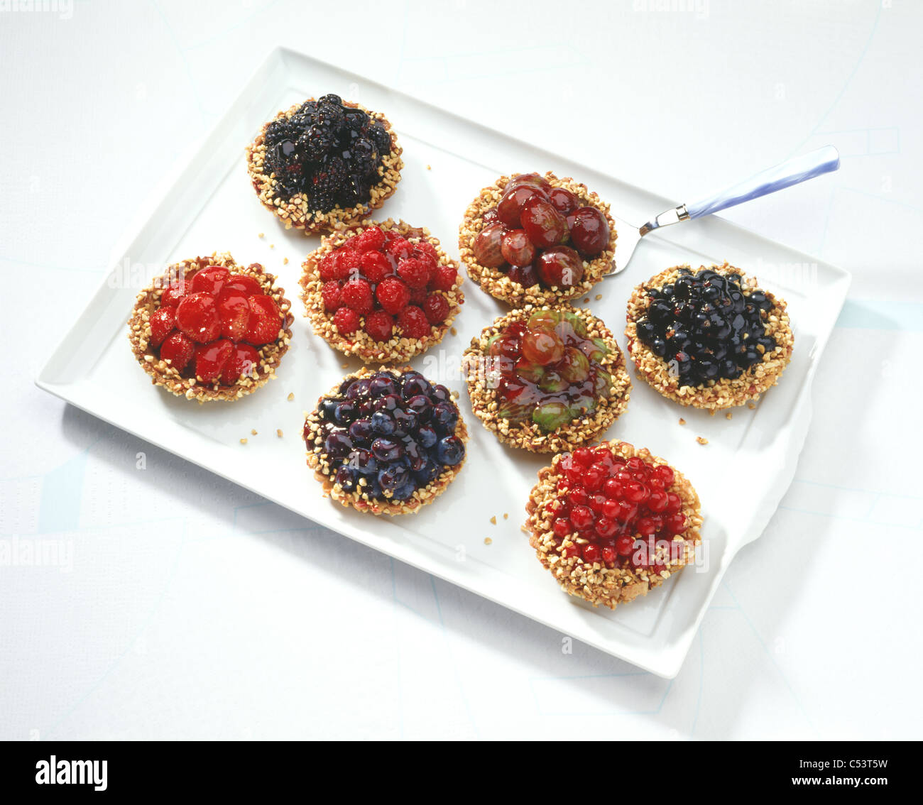 Small yeast pastry cake with summer fruits Stock Photo Alamy