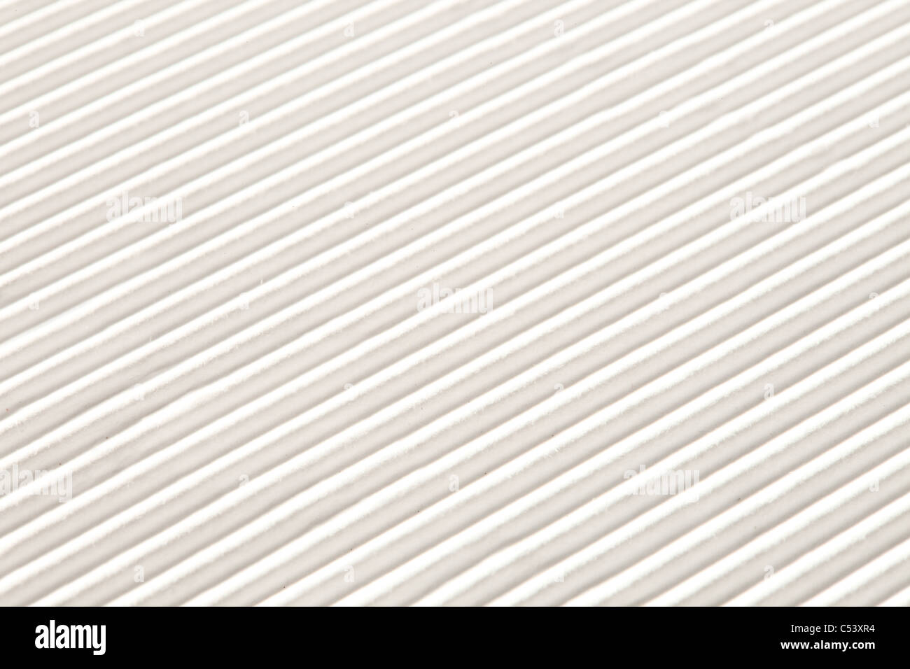 A closeup image of a white corrugated pattern, suitable for a ...