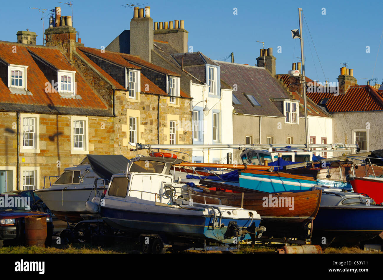 St Monans, Fife - a bright December day.  Boats laid up for the winter and village houses Stock Photo