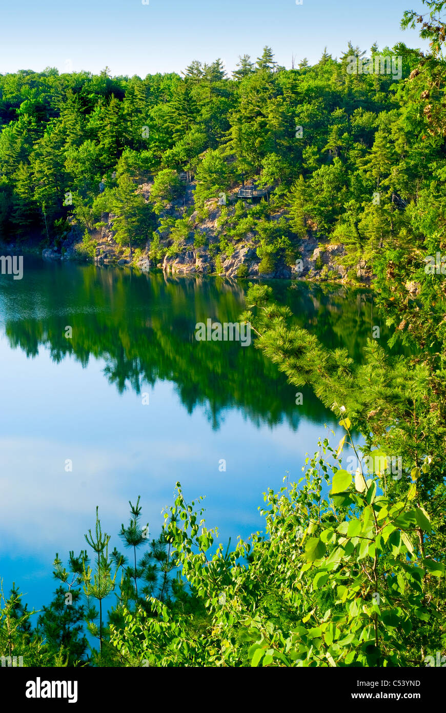 The blue waters of a very rare meromictic type of lake in Gatineau, Quebec, Canada. Stock Photo