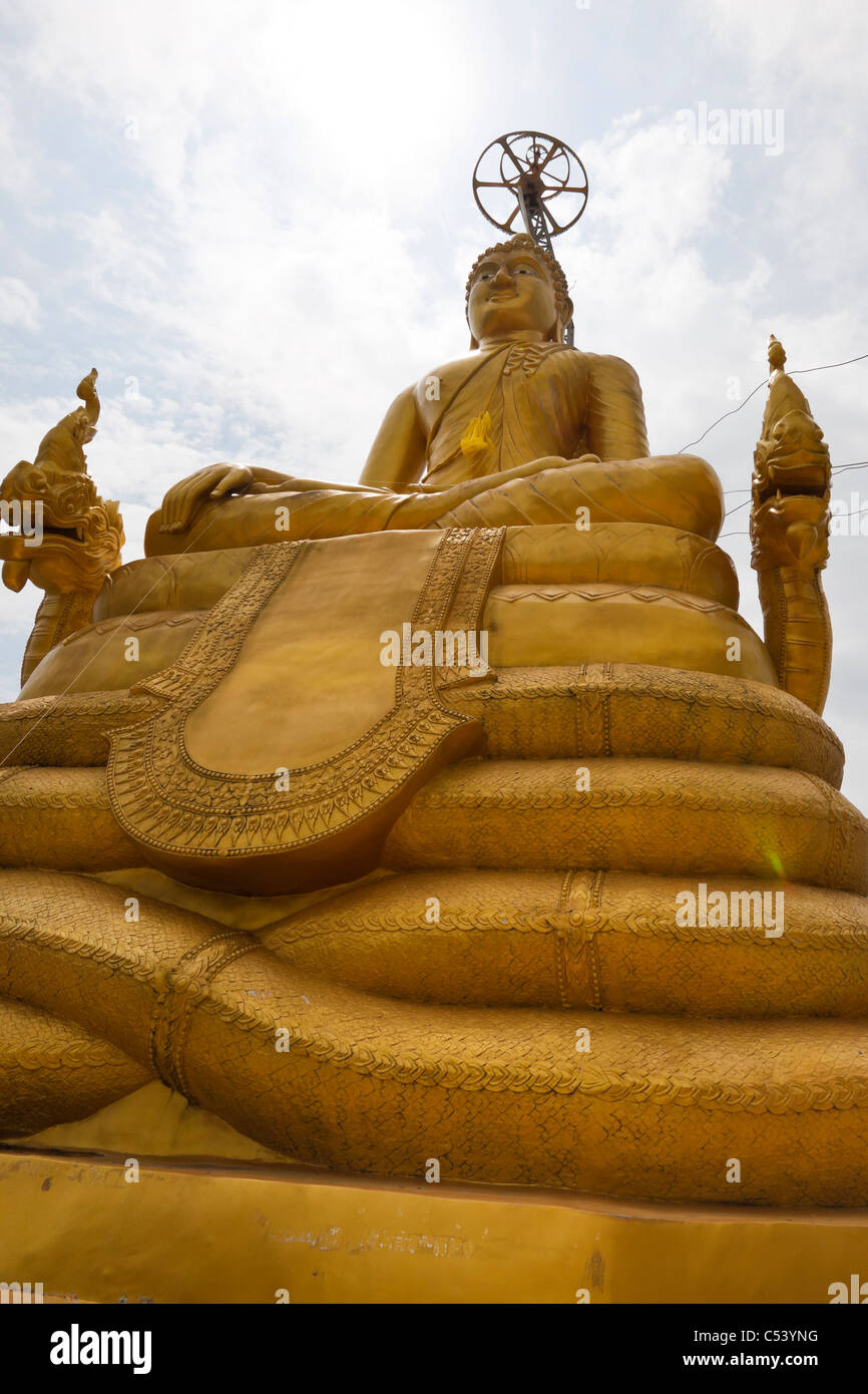 Detail of “smaller” 12 metres tall golden Buddha statue behind The Big Buddha the biggest, new attraction in Phuket, Thailand. Stock Photo