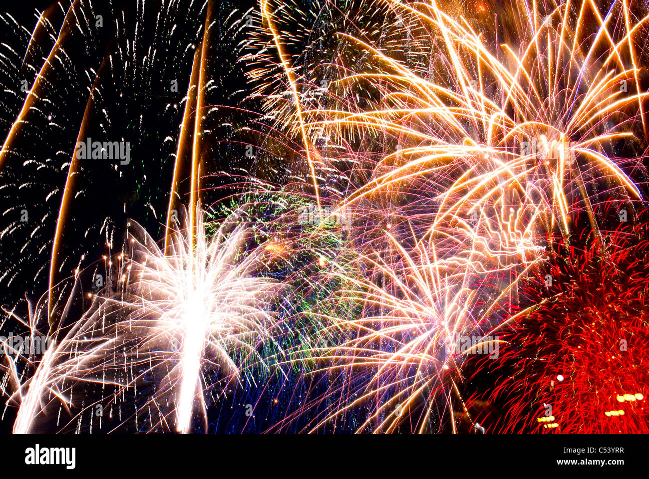 Digital collage of multiple fireworks detonations against the night sky. Stock Photo