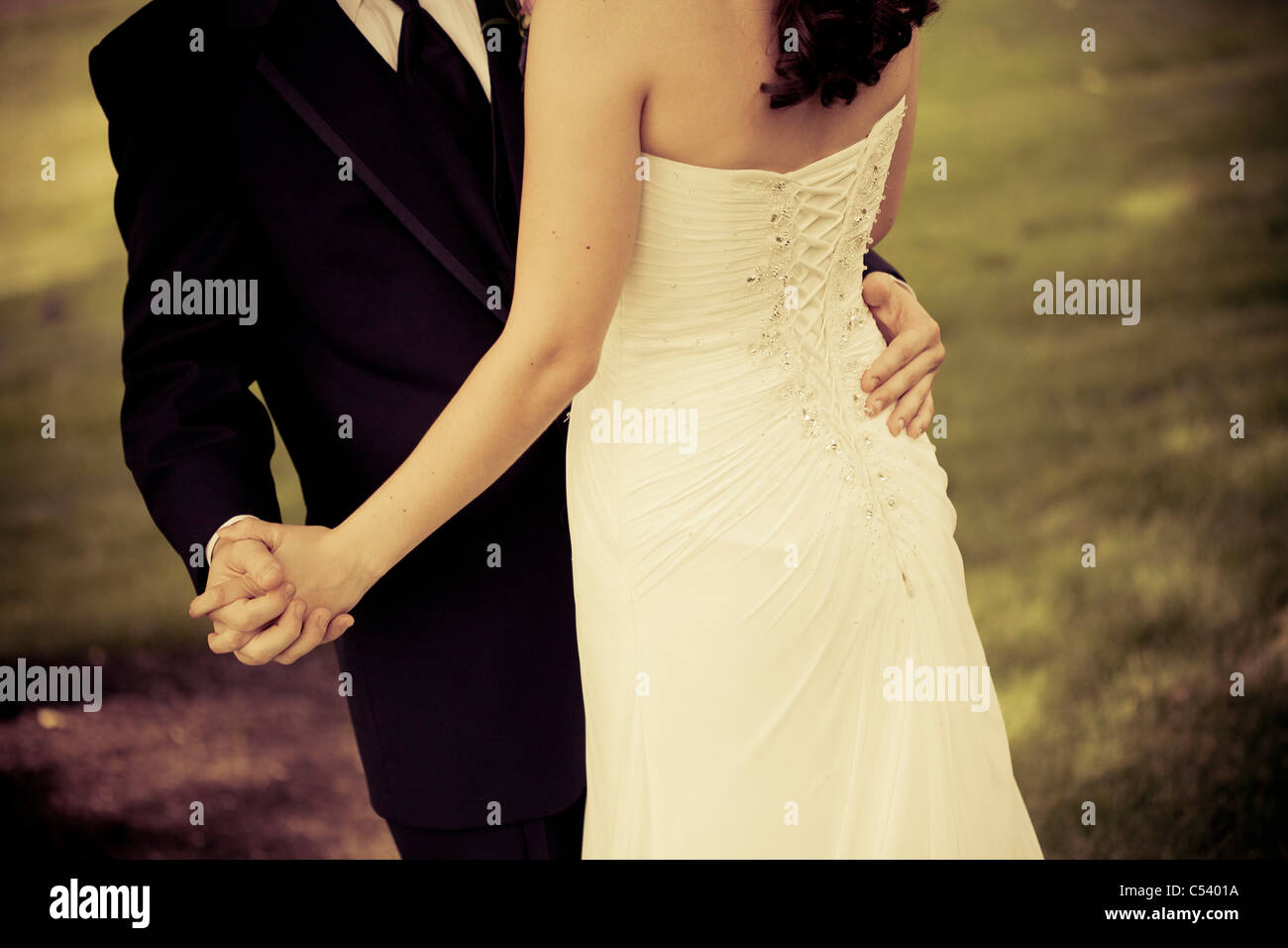 bride and groom holding each other Stock Photo