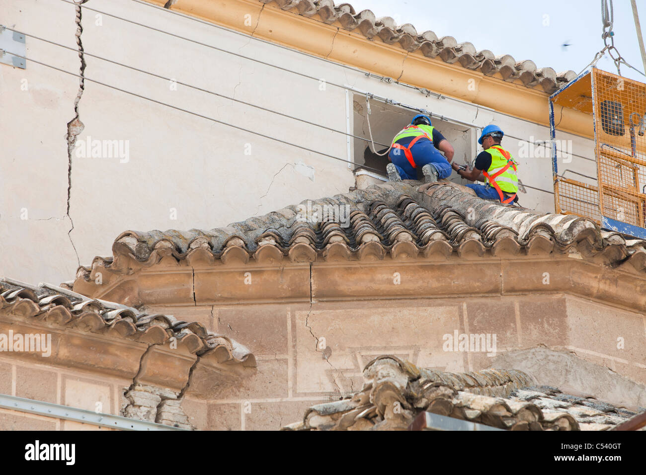 Inspect building damage hi-res stock photography and images - Alamy
