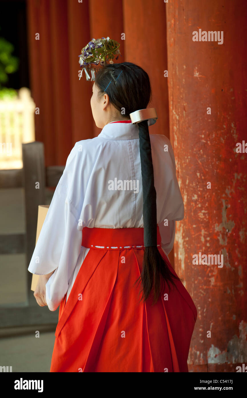Rear view of a japanese woman in kasuga taisha shrine hires stock