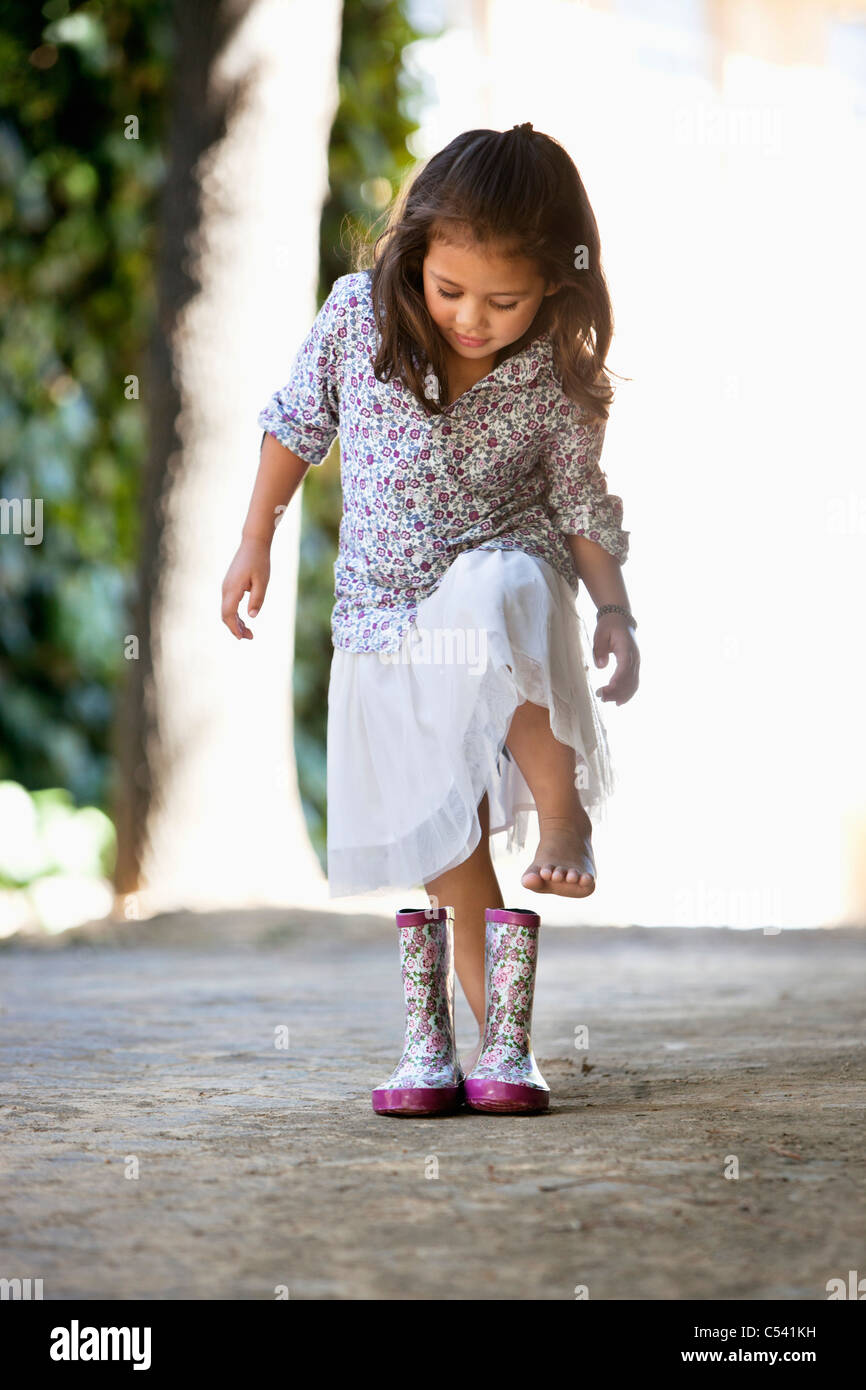 Cute girl wearing shoes Stock Photo Alamy